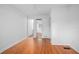Clean bedroom space with hardwood floors, and open closet at 2215 Lake Ruby Rd, Deland, FL 32724