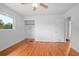 Bedroom featuring hardwood floors, closet, ceiling fan, and a window at 2215 Lake Ruby Rd, Deland, FL 32724