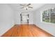 Bright, open living room with hardwood floors and a ceiling fan fixture at 2215 Lake Ruby Rd, Deland, FL 32724