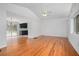 Open floor plan with hardwood floors, vaulted ceiling, connecting to a modern kitchen at 2215 Lake Ruby Rd, Deland, FL 32724