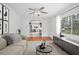 Comfortable living room with archway views of the dining room and updated kitchen at 2215 Lake Ruby Rd, Deland, FL 32724