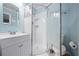 Modern bathroom with a glass-enclosed shower, sleek vanity, and updated fixtures at 2226 Sherwood Dr, South Daytona, FL 32119