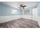 Bedroom features wood-look floors and plenty of natural light, creating a serene atmosphere at 2226 Sherwood Dr, South Daytona, FL 32119