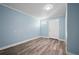 Light blue bedroom with new floor and walk in closet, bright and airy at 2226 Sherwood Dr, South Daytona, FL 32119