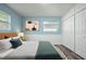 Comfortable bedroom with neutral decor, soft lighting, a plush bed, and closet, providing a serene retreat at 2226 Sherwood Dr, South Daytona, FL 32119