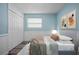 Comfortable bedroom features a neutral color scheme, closet, window, and stylish decor, creating a serene space at 2226 Sherwood Dr, South Daytona, FL 32119