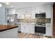 Recently updated kitchen with stainless steel appliances, stylish backsplash, and light cabinetry at 2226 Sherwood Dr, South Daytona, FL 32119