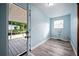 Bright laundry room with access to a screened in porch, new floor at 2226 Sherwood Dr, South Daytona, FL 32119