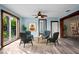 Living room featuring modern chairs, stylish decor, and wood-look floors, creating a welcoming space at 2226 Sherwood Dr, South Daytona, FL 32119
