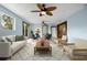 Spacious living room with cozy seating areas, multiple ceiling fans, and natural light at 2226 Sherwood Dr, South Daytona, FL 32119