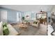 Open-concept living space provides ample seating and natural light, complemented by modern decor and flooring at 2226 Sherwood Dr, South Daytona, FL 32119