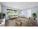 Bright and airy living room with wood-look flooring, plenty of space, and seamless flow to other areas at 2226 Sherwood Dr, South Daytona, FL 32119