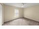 Cozy bedroom features carpet, neutral paint, and ceiling fan at 2747 Date Palm Dr, Edgewater, FL 32141