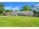 Charming single-story home with a well-manicured lawn and a two car garage at 2747 Date Palm Dr, Edgewater, FL 32141