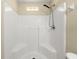 Clean white shower features a shower head and toiletry shelf at 2747 Date Palm Dr, Edgewater, FL 32141