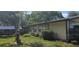 Charming single-story home with a well-maintained lawn and cozy front porch at 27751 Luella Ave, Paisley, FL 32767