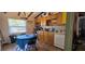 Functional kitchen with stainless steel appliances and adjacent dining area at 27751 Luella Ave, Paisley, FL 32767