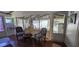 Relaxing sunroom with classic furniture and bright, natural lighting at 27751 Luella Ave, Paisley, FL 32767