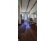 Inviting porch with rich wood flooring, stained glass accents, and comfortable seating at 27751 Luella Ave, Paisley, FL 32767