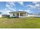A serene backyard with a screened porch provides a perfect spot for relaxation at 2884 Sweet Springs St, Deltona, FL 32738