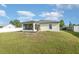 A spacious backyard featuring a screened lanai, ideal for enjoying the outdoors at 2884 Sweet Springs St, Deltona, FL 32738
