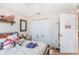 This cozy bedroom offers a warm, inviting atmosphere with ample closet space for storage at 2884 Sweet Springs St, Deltona, FL 32738