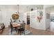 Bright dining room features decorative lighting, an arched entry, wood-look flooring and plenty of natural light at 2884 Sweet Springs St, Deltona, FL 32738