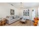 Inviting living room with neutral tones, comfortable seating, and charming decor, perfect for relaxing at 2884 Sweet Springs St, Deltona, FL 32738