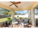 Relax on the screened patio, complete with a ceiling fan and comfortable seating at 2884 Sweet Springs St, Deltona, FL 32738
