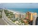 Aerial view of the building, beach and ocean on a sunny day in beautiful Daytona Beach, Florida at 2901 S Atlantic Ave # 401, Daytona Beach Shores, FL 32118