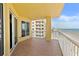 Balcony with tile flooring and white railings offering expansive ocean views at 2901 S Atlantic Ave # 401, Daytona Beach Shores, FL 32118