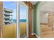 Balcony view of the ocean and a peek into the bathroom with a soaking tub at 2901 S Atlantic Ave # 401, Daytona Beach Shores, FL 32118