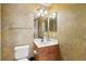 Bathroom with toilet, vanity, and unique textures at 2901 S Atlantic Ave # 401, Daytona Beach Shores, FL 32118