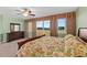 Bedroom featuring a large bed and dresser with a view of the city at 2901 S Atlantic Ave # 401, Daytona Beach Shores, FL 32118