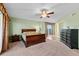 Comfortable bedroom with carpet, balcony, and ceiling fan at 2901 S Atlantic Ave # 401, Daytona Beach Shores, FL 32118