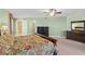 Spacious bedroom features a dark dresser, closet access, and balcony at 2901 S Atlantic Ave # 401, Daytona Beach Shores, FL 32118