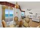 Inviting dining area with ocean views, stylish furniture, and a decorative hanging light fixture at 2901 S Atlantic Ave # 401, Daytona Beach Shores, FL 32118
