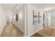 Elegant hallway featuring decorative wall art, tile flooring, and recessed lighting at 2901 S Atlantic Ave # 401, Daytona Beach Shores, FL 32118