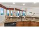 A gourmet kitchen with granite countertops, stainless steel appliances and views of the living space and ocean at 2901 S Atlantic Ave # 401, Daytona Beach Shores, FL 32118