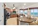 Modern kitchen showcasing granite countertops, stylish backsplash, and a breakfast bar with ocean views at 2901 S Atlantic Ave # 401, Daytona Beach Shores, FL 32118