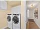 Washer and dryer in laundry room at 2901 S Atlantic Ave # 401, Daytona Beach Shores, FL 32118