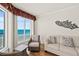 Comfortable living room with large windows showcasing ocean views and modern decor at 2901 S Atlantic Ave # 401, Daytona Beach Shores, FL 32118