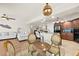 Open-concept living space featuring a dining area, kitchen, and seating, creating an inviting atmosphere at 2901 S Atlantic Ave # 401, Daytona Beach Shores, FL 32118