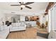 Bright living room featuring wood floors, comfortable seating, and an open floor plan to the kitchen at 2901 S Atlantic Ave # 401, Daytona Beach Shores, FL 32118