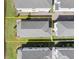 Aerial view of a house with a dark roof surrounded by green grass at 2916 Meleto Blvd, New Smyrna Beach, FL 32168