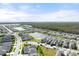 Panoramic aerial view of a two-story home, set within a community boasting lush landscapes and tranquil water features at 2916 Meleto Blvd, New Smyrna Beach, FL 32168