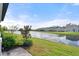 Scenic backyard featuring a picturesque waterfront view and lush landscaping at 2916 Meleto Blvd, New Smyrna Beach, FL 32168
