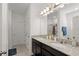 Bathroom with double sinks, granite counters, and a separate shower and toilet room at 2916 Meleto Blvd, New Smyrna Beach, FL 32168