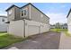 Exterior elevation showing the garage and driveway of the property at 2916 Meleto Blvd, New Smyrna Beach, FL 32168