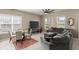 Comfortable living room with a dining area, plush seating, and a large window for natural light at 2916 Meleto Blvd, New Smyrna Beach, FL 32168